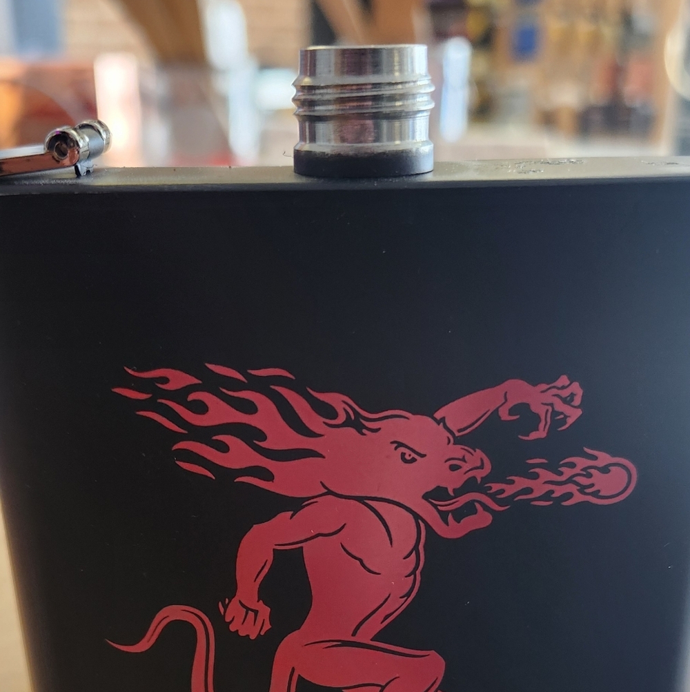 Black Flask with Red Fire-Breathing Creature Design